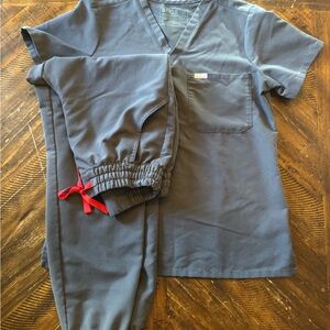 Gray women’s FIGS scrubs with Red Accents